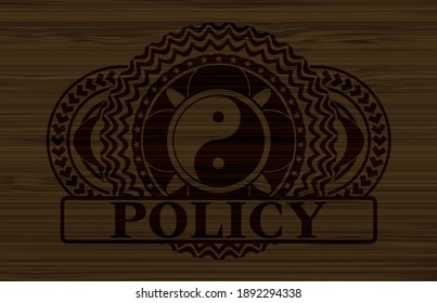 Yin yang icon and Policy text badge on dark wood background. Brown handsome background. Artistic illustration. 