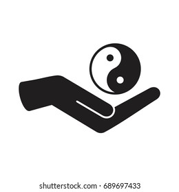 Yin and yang symbolic in hand 