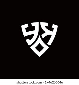 YK monogram logo with modern shield style design template isolated on black background