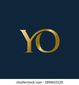 YO monogram logo.Abstract typographic signature icon.Letter y and letter o.Lettering sign isolated on dark background.Alphabet initials.Metallic gold uppercase wedding characters and swirl element.