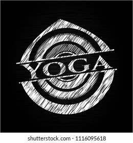 Yoga chalk emblem written on a blackboard