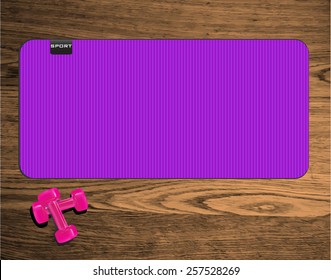 yoga mat on wood texture floor with pink dumbbells