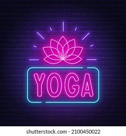 Yoga neon sign on brick wall background