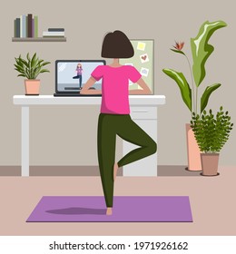 Yoga online concept with young woman doing yoga exercise at home with online classes on laptop with instructor. Live stream, internet training. Cozy modern interior. Home office