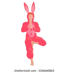 Yogi girl in rabbit pajamas meditates in tree pose