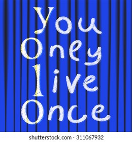 Yolo. You only live once. On the background of blue theater curtain. The concept of freedom and progress.