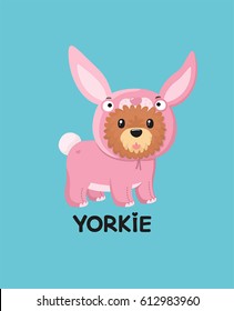 Yorkshire Terrier dog. The puppy is dressed in a pink rabbit costume.