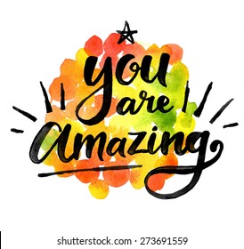 You are amazing. Hand drawn calligraphic inspiration quote on a watercolor background.