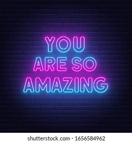 You are so amazing neon lettering on brick wall background.