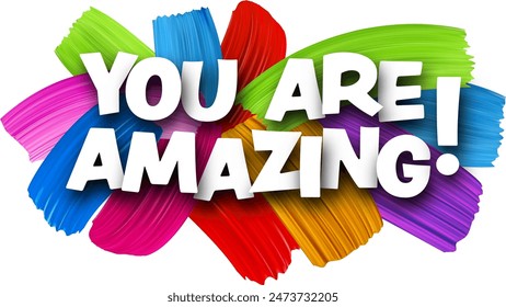 You are amazing paper word sign with colorful spectrum paint brush strokes over white. Vector illustration.