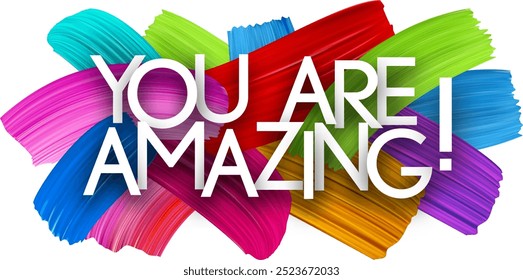 You are amazing paper word sign with colorful spectrum paint brush strokes over white. Vector illustration.