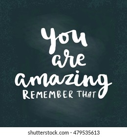 You are amazing, remember that. Hand drawing ink lettering vector art, modern brush calligraphy motivational poster on chalk board background. Enjoy the little things.