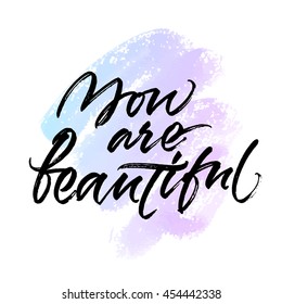 You are beautiful card design. Handwritten brush calligraphy on abstract blue and violet background. Vector image isolated on white background.
