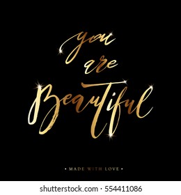 You are beautiful golden ink card. Hand drawn gold shiny lettering background. Modern brush calligraphy. Isolated on black background. Compliment for women. Vector illustration stock vector.