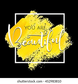 You are beautiful, inspirational phrase of white color in the frame. Yellow brush strokes with rough edges. Vector illustration. Hand drawn element for your design.