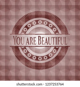 You are Beautiful red emblem or badge with abstract geometric polygonal pattern background. Seamless.