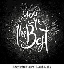 You Are the Best. Hand lettering grunge card with flower background. Handcrafted doodle letters in retro style. Hand-drawn vintage vector typography illustration