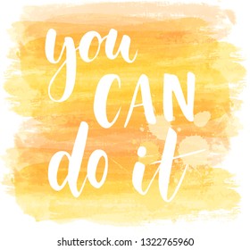You can do it - handwritten modern calligraphy text on abstract paint brushed yellow background. Motivational message.