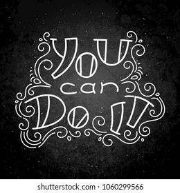 You can do it.Hand drawn modern image with hand-lettering and decoration elements on blackboard. Inspirational quote. Illustration for prints on t-shirts and bags, posters, cards.