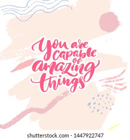 You are capable of amazing things. Inspirational quote calligraphy for planners, journals, posters and clothing. Modern brush lettering, pink text on abstract background