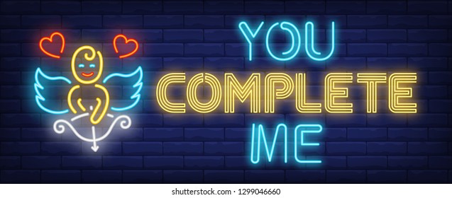 You complete me neon text with cupid and hearts. Saint Valentines Day design. Night bright neon sign, colorful billboard, light banner. Vector illustration in neon style.