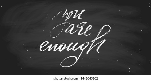 You are enough. Handwritten text, wall decoration. Hadnwriting. script vector. Chalk on a blackboard. Each word is on the separate layer. 