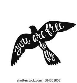 You are free to fly. Inspirational quote about freedom. Handwritten phrase in flying bird. Lettering in boho style for tee shirt print and poster. Typographic design