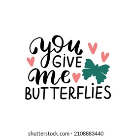 You give me butterflies. Happy Valentines Day hand lettering quote. Greeting card wallpaper t shirt desig element. Modern calligraphy hand written background text. 