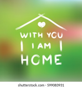 With you i am home. phrase written by hand on a blurred green background. Art grunge typography for design