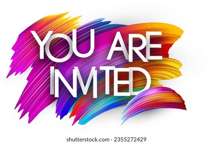 You are invited paper word sign with colorful spectrum paint brush strokes over white. Vector illustration.