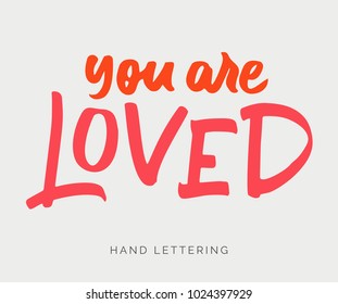 You are loved. Handwritten elegant phrase for your design. Custom hand lettering. Can be used for posters, cards, banners, social media campaigns, textile designs, etc.