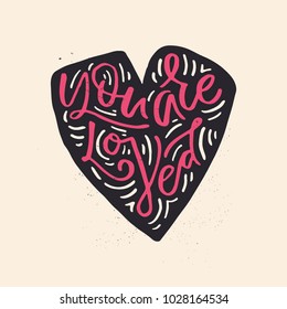 You are loved - lttering inside the heart shape. Unique sign made with brush. Handdrawn lettering converted to vector. 