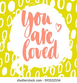You are loved. Vector motivation and inspirational quote on a bright abstract yellow background.. Hand lettering. Typographical element for your design.