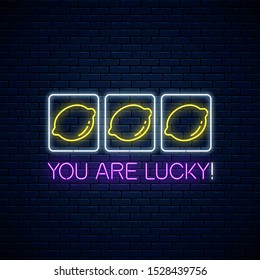 You are lucky - glowing neon motivation phrase with three lemons on slot machine. Slot machine win combination with lemons and text in neon style. Vector illustration.