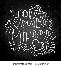 You make me happy. Hand drawn modern image with hand-lettering and decoration elements on blackboard. Inspirational quote. Illustration for prints on t-shirts and bags, posters, cards.