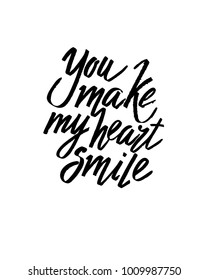 You make my heart smile Valentines day calligraphy card. Hand drawn design elements. Handwritten modern brush lettering.