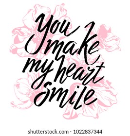 You make my heart smile Valentines day calligraphy card. Hand drawn design elements. Handwritten modern brush lettering.