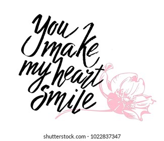 You make my heart smile Valentines day calligraphy card. Hand drawn design elements. Handwritten modern brush lettering.
