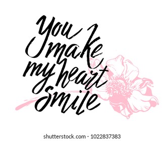 You make my heart smile Valentines day calligraphy card. Hand drawn design elements. Handwritten modern brush lettering.