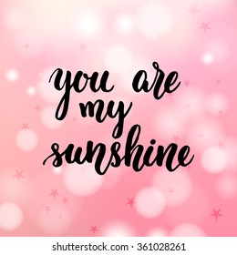 You are my sunshine hand lettering on pink background. Vector illustration.