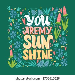 You are my sunshine. Yellow inscription, on a color background, surrounded by flowers. Lettering and calligraphy.
