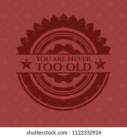 You are Never too old badge with red background