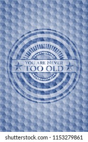 You are Never too old blue emblem or badge with abstract geometric pattern background.