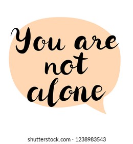 You are not alone text. Brush calligraphy. Vector isolated illustration