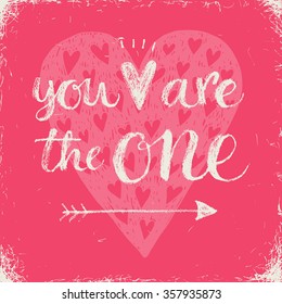 You are the one! Hand lettering Valentines day phrase on a pink background.