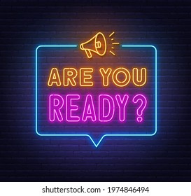 Are You Ready neon sign in the speech bubble on brick wall background.