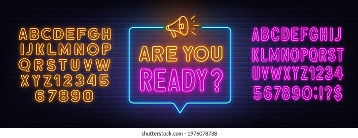 Are You Ready neon sign in the speech bubble on brick wall background.