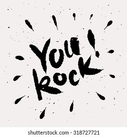 You rock! Black hand lettering on light background.
