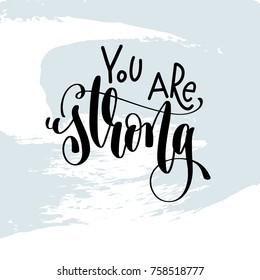 you are strong - hand lettering inscription on blue brush stroke background, inspiration and motivation positive quote, calligraphy vector illustration