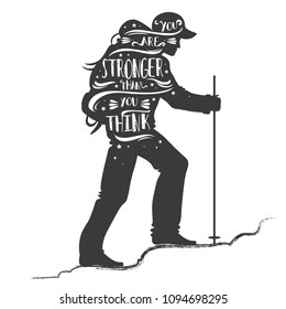 You are stronger than you think. Motivational and inspirational typography. Quote. Tourist with a backpack going up the hill